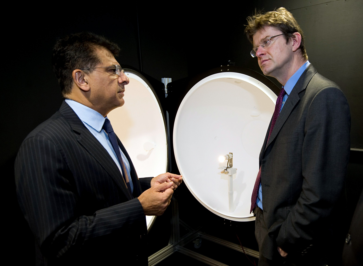 Managing Director Sunil Kotecha and man infront of Integral LED's integrating sphere