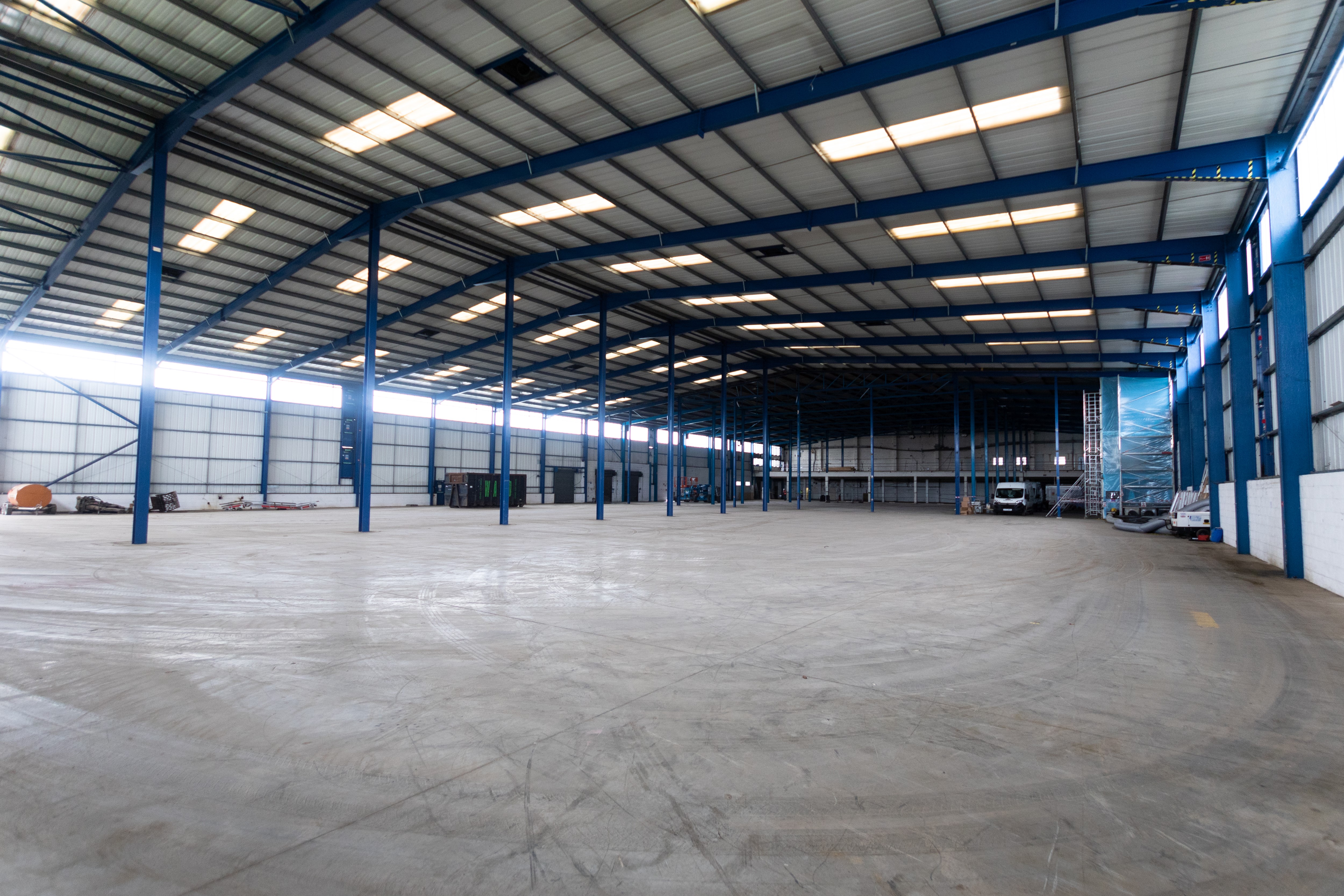 Inside of the empty Calverton warehouse before new lighting scheme and racking were installed