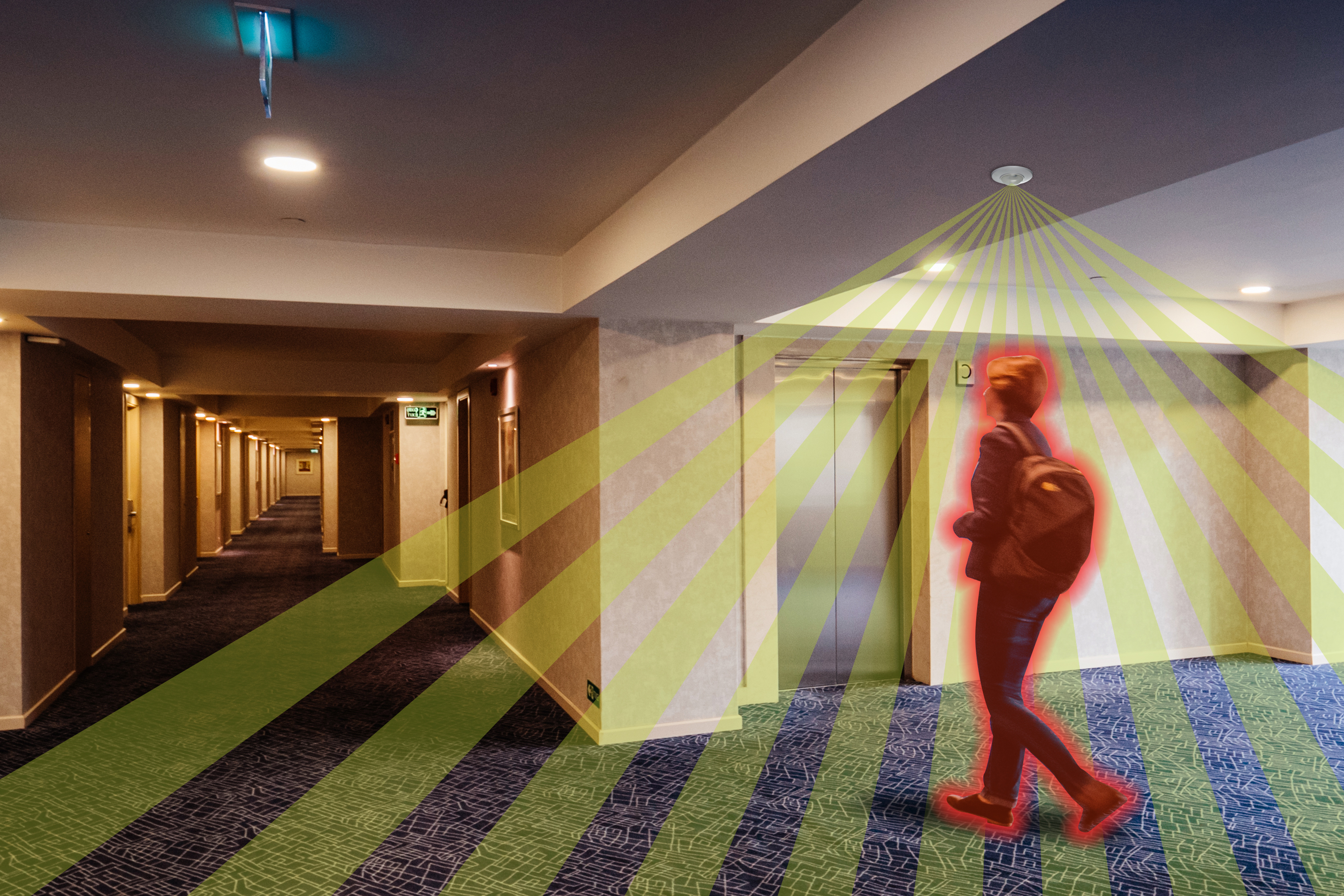 Woman walking in corridor with illustration of PIR sensor detection over the top. The woman has a red glow to indicate heat.
